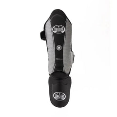 Front view of Topgear Titan shin guard with foot protector in black and white
