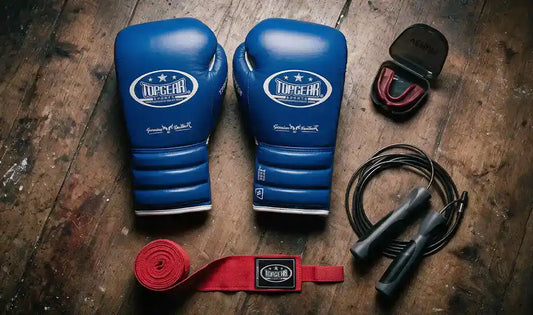 Boxing accessories placed on wooden floor