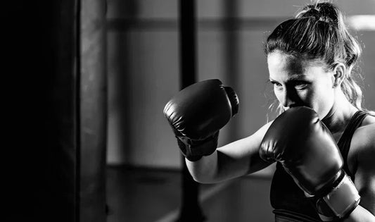 female boxer training with gloves