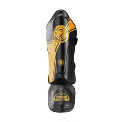 TOPGEAR Fight Club shin guards black and gold, front view with curved shin protection and foot guard