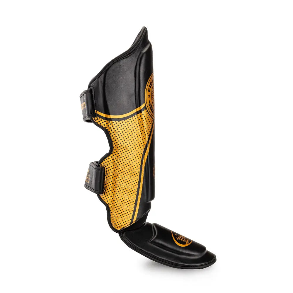 Side view of TOPGEAR Fight Club shin guard gold showing contoured shape, strap fasteners and foot protector