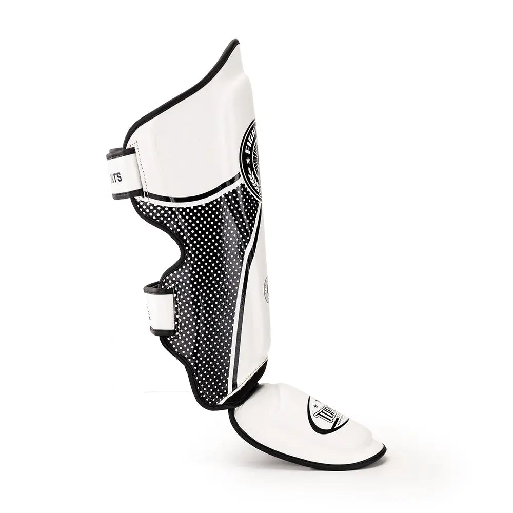 Side view of white TOPGEAR Fight Club shin guard with dotted panel, curved shin cover and strap closure