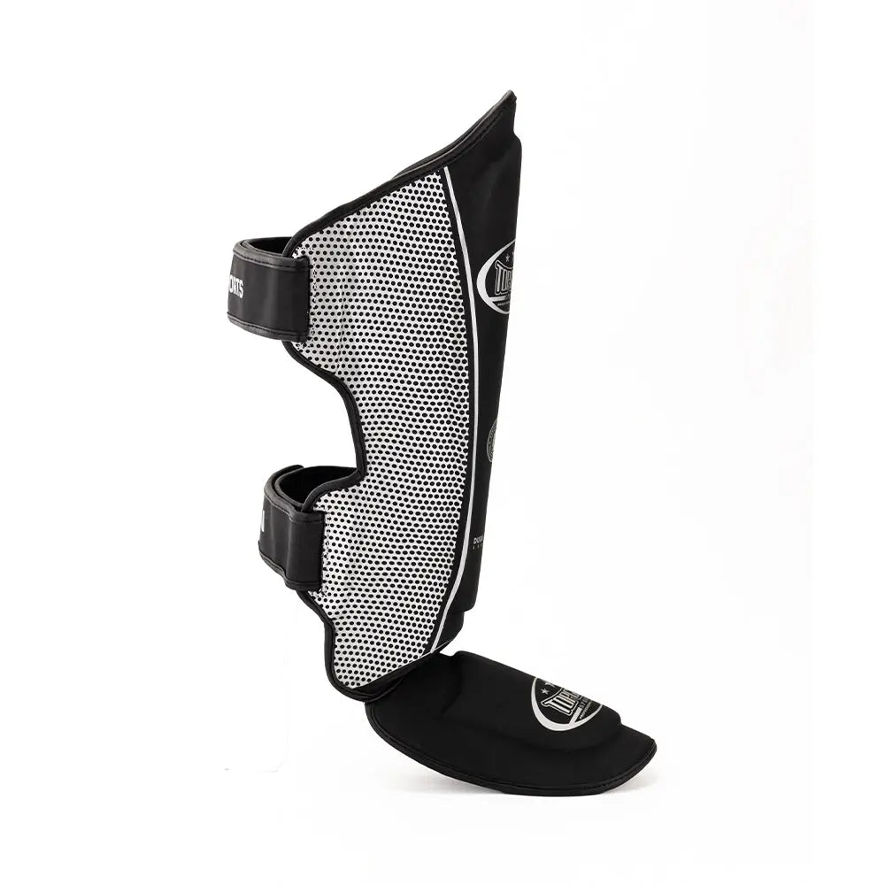 Side view of Topgear Titan shin guard showing curved design and foot guard
